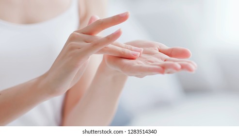 Beautiful Woman Apply Moisturizer Into Her Hand At Home