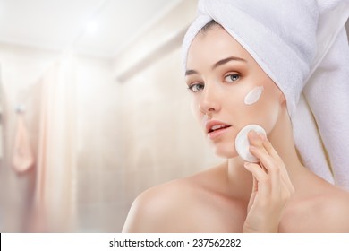 Beautiful Woman Applying Cosmetic Cream