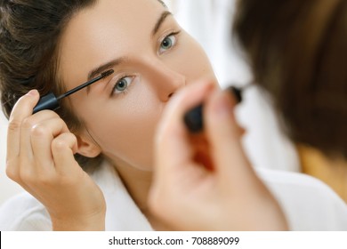 Beautiful Woman Is Applying Tinted Eyebrow Gel