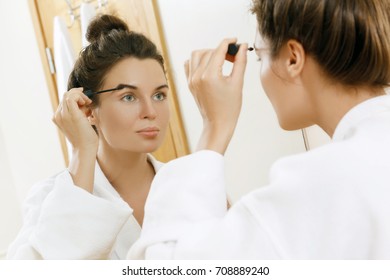 Beautiful Woman Is Applying Tinted Eyebrow Gel