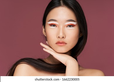 Beautiful woman Asian appearance bright makeup luxury pink background charm