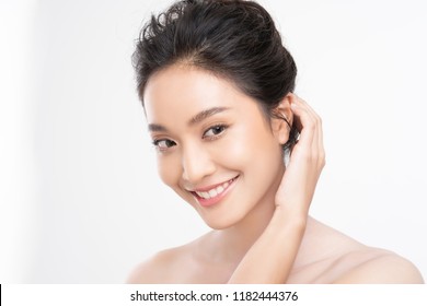 Beautiful woman asian face close up studio .She is catching hair