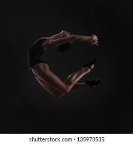 Beautiful Woman Ballet Dancer Isolated On Studio Black Background