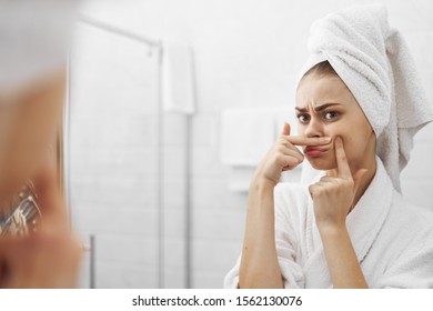 Beautiful woman bathroom mirror skin care - Shutterstock ID 1562130076