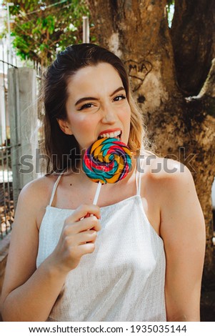 Beautiful woman with big lollipop