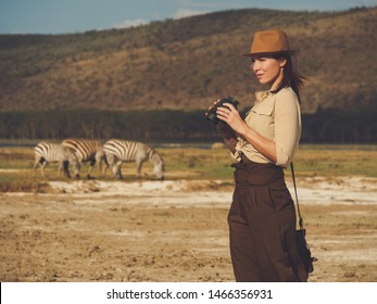 Beautiful Woman With Binoculars At Savanna In Kenya