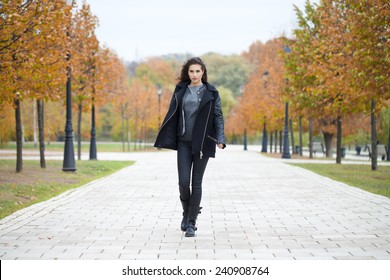 Beautiful Woman In Black Coat Walking Autumn Street