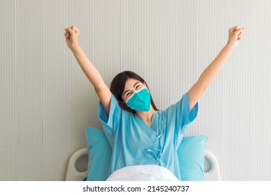 Beautiful Woman With Black Long Hair In Patient Gowns At A Hospital Bed Feels Relaxed. Selective Focus.