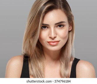 Beautiful Woman Blonde Hair Portrait Close Up Studio On Gray