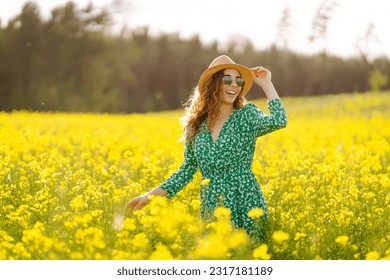 Beautiful woman in the blooming field. Nature, vacation, relax and lifestyle. Summer landscape. - Powered by Shutterstock