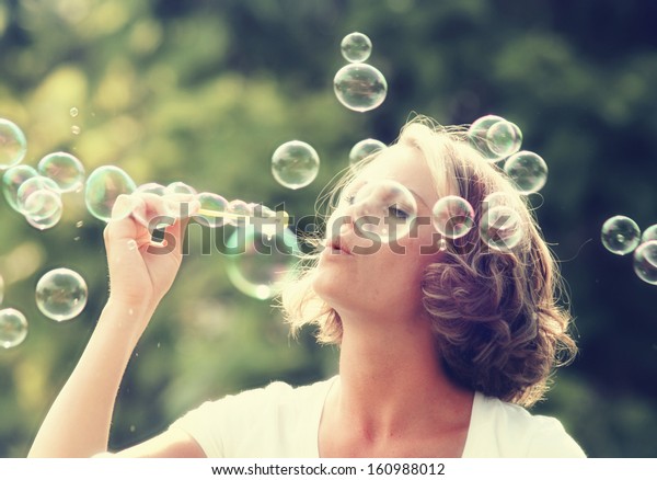 Beautiful Woman Blowing Bubbles Stock Photo Edit Now 160988012