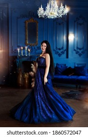 Beautiful Woman In A Blue Ball Gown And Blue Room