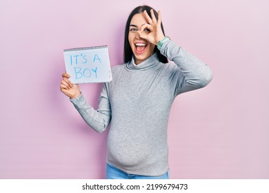 Beautiful Woman With Blue Eyes Expecting A Baby Holding Its A Boy Banner Smiling Happy Doing Ok Sign With Hand On Eye Looking Through Fingers 