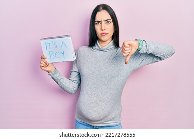 Beautiful Woman With Blue Eyes Expecting A Baby Holding Its A Boy Banner With Angry Face, Negative Sign Showing Dislike With Thumbs Down, Rejection Concept 