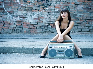 Beautiful Woman With Boom Box On The Street