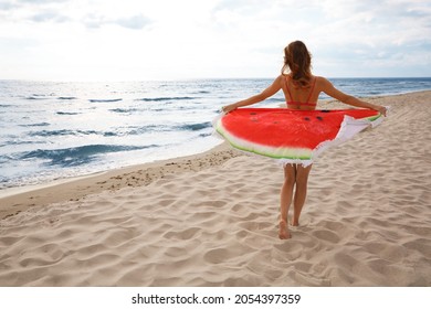 Beautiful Woman With Bright Beach Towel On Seashore, Back View