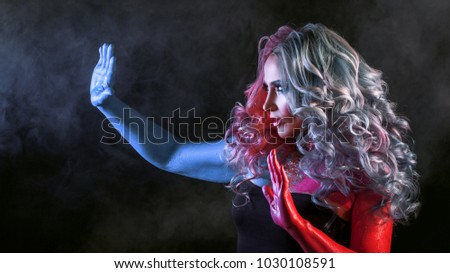 Similar – Beautiful young woman posing with blue makeup