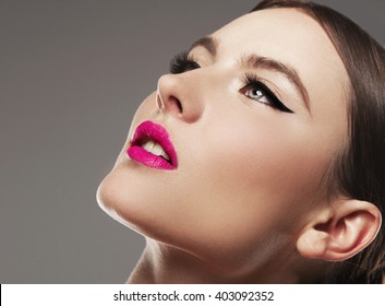 Beautiful Woman With Bright Make Up Eye With Sexy Black Liner Makeup. Fashion Big Arrow Shape On Woman's Eyelid. Chic Evening Make-up