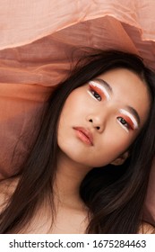 Beautiful woman bright makeup Asian appearance luxury model