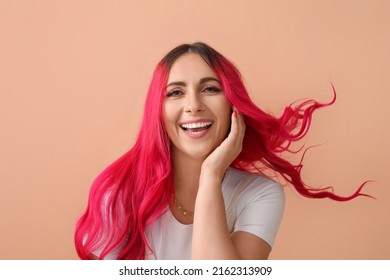 Beautiful Woman With Bright Pink Hair On Beige Background