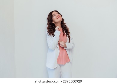 Beautiful woman brunette emotion portrait on white background - Shutterstock ID 2395500929