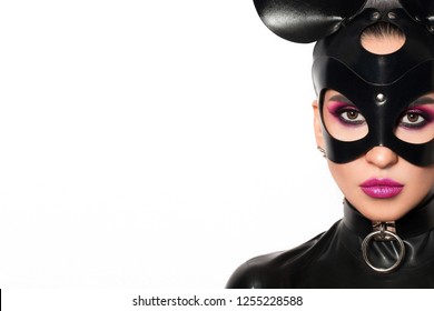 Beautiful Woman Brunette Model Vamp Mistress Dominatrix Bdsm Woman In Glamour Latex Dress And Black Leather Fetish Mouse Mask Posing In Sex Shop White Room