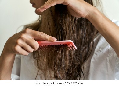 Beautiful Woman Brushing Her Wet Messy Hair After Bath With Comb. Thin Hair Porblem