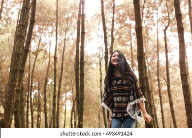 Beautiful Woman with camera take adventure on forest on autumn season