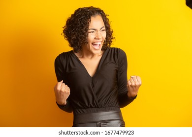 beautiful woman celebrating, celebrating, yes. Success concept - Shutterstock ID 1677479923