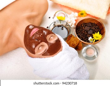 Beautiful woman with chocolate mask on her face