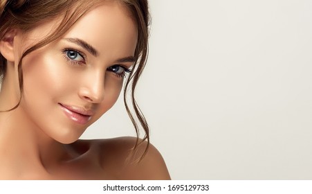 Beautiful woman with clean skin on her face. Pretty girl with natural make-up . Beauty, cosmetics and cosmetology.  - Shutterstock ID 1695129733