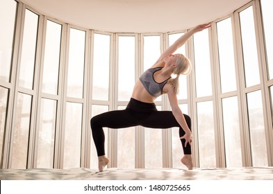 Beautiful Woman Coach Yoga Practice. Yoga Concept. Sumo Squat Pose