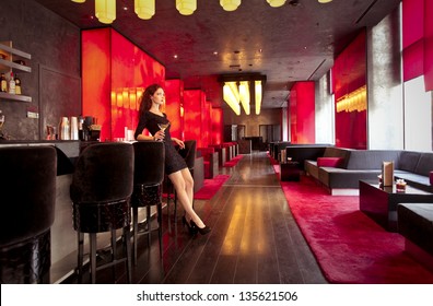 Beautiful Woman With A Cocktail In A Luxury Lounge