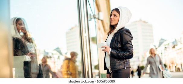 Beautiful Woman With Coffee And Credit Card, Looking Through Store Window.