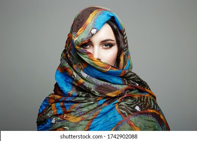 beautiful woman in color veil. beauty girl in colorful hijab. fashion islamic or indian style woman. ethnic people