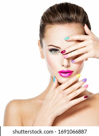 Beautiful woman  with colored nails and pink lips. Attractive stylish fashion model