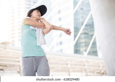 Beautiful Woman  Cool Down After Work Out With White Towel During Sunset