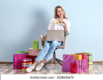 Beautiful Woman With Credit Card And Laptop Indoors. Online Shopping Concept