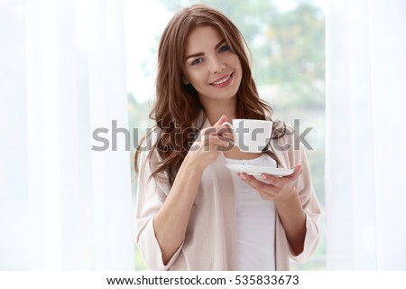 https://image.shutterstock.com/image-photo/beautiful-woman-cup-aromatic-coffee-450w-535833673.jpg