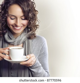 Beautiful Woman With Cup of Tea or Coffee - Powered by Shutterstock