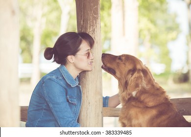 Beautiful Woman With A Cute Golden Retriever Dog