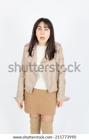 Beautiful woman doing different expressions in different sets of clothes: bad surprise