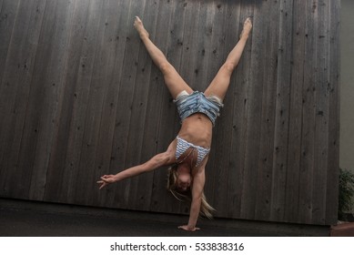 Beautiful Woman Doing One Arm Handstand In Cutoffs And Bikini Top Very Cute 