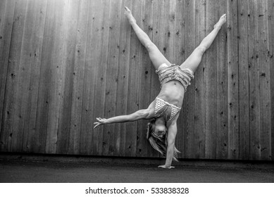 Beautiful Woman Doing One Arm Handstand In Cutoffs And Bikini Top Very Cute 