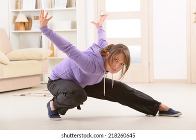 Beautiful Woman Doing Qi Gong Tai Chi Exercise At Home