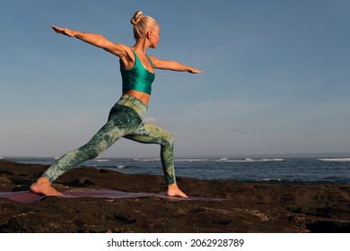 beautiful woman doing yoga. middle plan. bali
