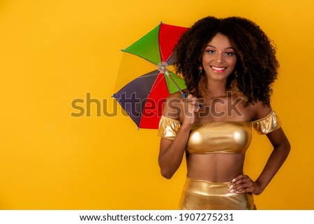 Beautiful woman dressed for carnival night. Black woman with carnival mask