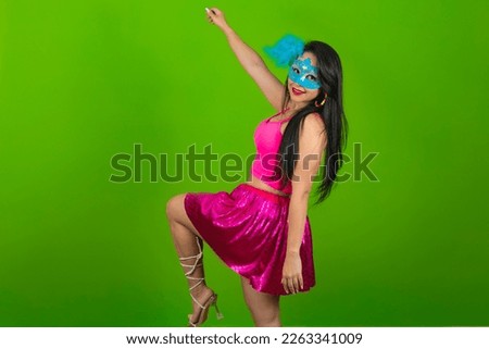 Beautiful woman dressed for carnival night. Smiling woman ready to enjoy the carnival with a colorful mask