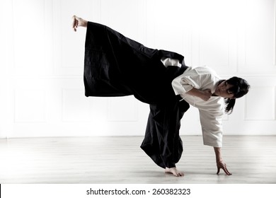 Beautiful Woman Dressed In A Hakama, Practicing  Kung Fu 