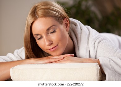 Beautiful Woman In Dressing Gown Relaxing In Spa